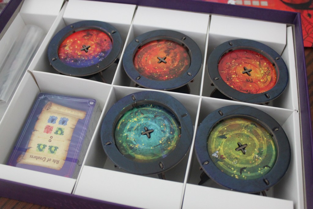 Whirling Witchcraft box with spaces designed to store the cauldrons